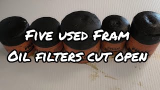 Five used Fram Extra Guard oil filters cut open