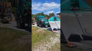 plowing cables alongside asphalt roads