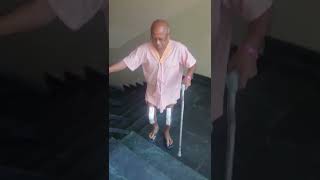 Patient climbing stairs after knee replacement