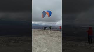 Reverse paraglider launch in strong wind. Aguergour, Morocco