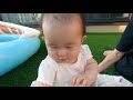 japanese baby challenging the pool for the first time