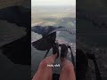 eagle landed on paraglider s foot in middle of the sky shorts paragliding egale