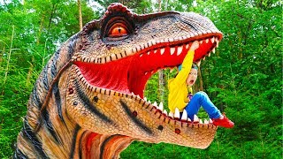 Senya and Dad Play in the Dinosaur Park