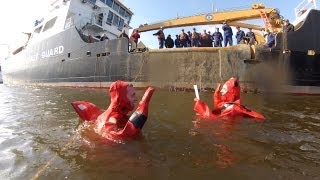 Coast Guard crew conducts member's first re-enlistment wearing survival suits