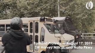 Group of protesters bust window of bus said to be carrying Proud Boys