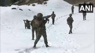 Indian Army personnel patrol the upper areas of Doda amid a thick blanket of snow