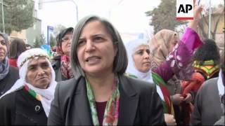 Kurdish women gather to mark women's day and protest Paris killings