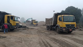 kobelco 140 excavator grey wall loading BharatBenz tipper. kobelco excavator video.