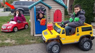 Playing restaurant drive thru in our playhouse and Power Wheels Car