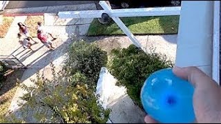 throwing water balloons at people