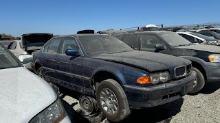 Four BMW E38 7 Series Sedans at Junkyard