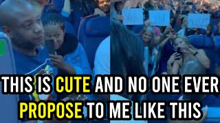 As passengers join in mid-flight, an airplane restroom marriage proposal goes viral