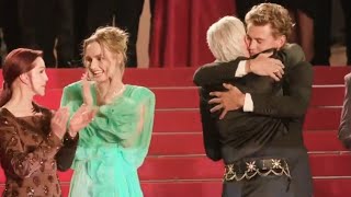 Austin Butler & Baz Luhrmann share a hug after Elvis received a 12-minute standing ovation at Cannes