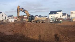 Caterpillar 336F loading Trucks