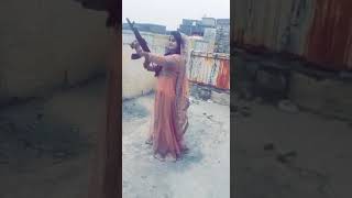 Girl firing in Ak47