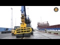 mantsinen hybrilift 160 loading a ship with wrapped bales