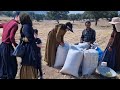 Milling agricultural products with a tractor by Abbas and his father