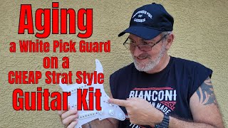 How to Aged a White Pick Guard on a CHEAP Strat Style Guitar Kit.