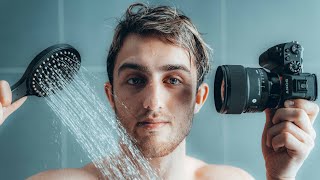 Photographer takes photos of himself in shower.