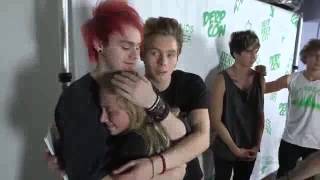 Michael Clifford hugs a crying fan at Derp Con