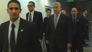 Israeli Prime Minister Benjamin Netanyahu, surrounded by security guards
