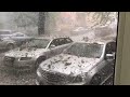 gigantic hailstones and rocks rain down on cars during storm 1046275