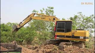 CAT E120B Excavator Loading Land On Trucks / Poor Excavator Wave To Show Truck When Full