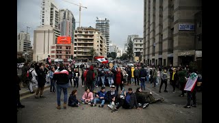 Lebanese block roads as revived protests enter fourth month