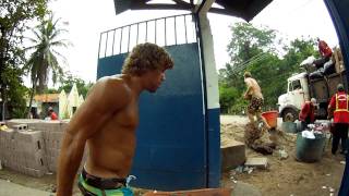 UFC fighter Uriah Faber in boardshorts helps to build a school in El Salvador with Surf For Life