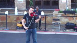 Violinist Omar Lopez performs \