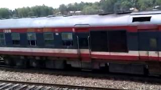 Alco locomotive pulls a DEMU train