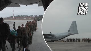 Marines board plane to Guantanamo Bay after Trump promises to send criminal migrants there