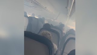 Videos from inside Delta flight that rerouted back to Atlanta over 'haze' in plane