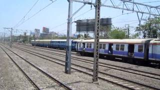 [IRFCA] ADI-BCT Karnavati Express passing and a MRVC EMU overtaking swiftly!!!!!!!!!