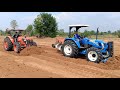 รถไถ new holland tt 4.75 กับ kubota m8540 ปรับคันนา