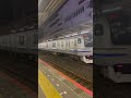 総武線各駅停車のホームから東西線直通快速中野行きと総武線快速ホームから快速東京行き船橋駅を同時に発車