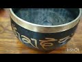 water droplets dancing in tibetan singing bowl