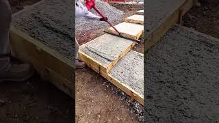 Concrete flattening process with a handheld scraper