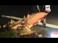 Workers lifted the fuselage of a TransAsia Airways ATR 72 propjet from a shallow river in Taipei, Ta