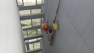 Firefighters rescue man dangling from rope 16 stories up