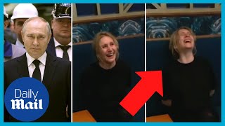 Russian woman jailed for criticising Putin laughs maniacally at prison guard
