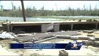 Meteorologists from the National Weather Service surveying damage