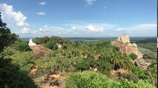 Mihintale, Sri Lanka, a view of a Buddha from a far away