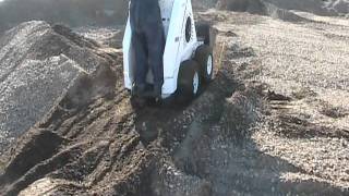 RAMROD Mini Skid Loader 930 - working in the dirt pile.