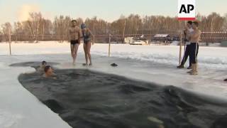 Raw: Russian 'Seals' Take Icy Christmas Plunge