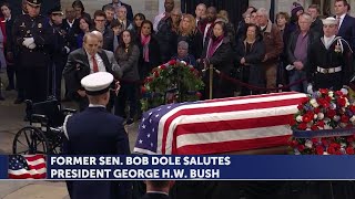 Former Sen. Bob Dole salutes George H.W. Bush