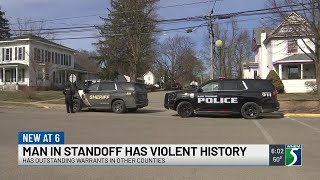 Man accused of standoff had outstanding warrants