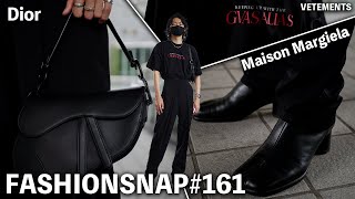 A man wearing Dior, Maison Margiela, and VETEMENTS. He has a cool black style. [FASHION SNAP # 161]