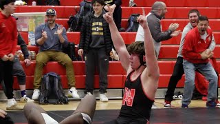 Naperville Central wrestler Will Erbeck pins his opponent in the final moments for a championship