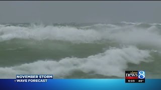 Large waves close piers, draw crowds